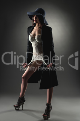 Erotica and style. Image of model posing in studio