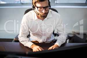 Businessman with glasses working on computer