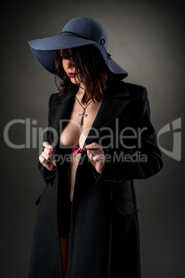 Studio photo of glamorous woman bared her breasts