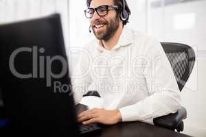 Businessman with glasses working on computer