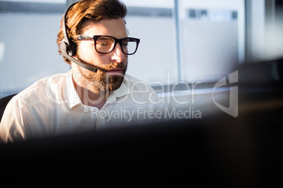 Businessman with glasses working on computer