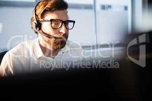 Businessman with glasses working on computer