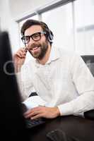 Businessman smiling and working on the phone