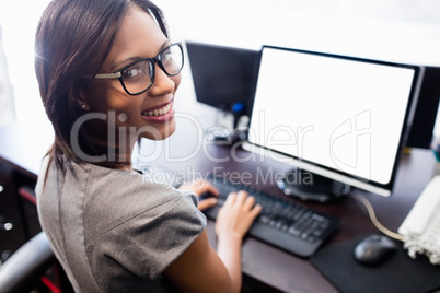 Casual businesswoman working on laptop