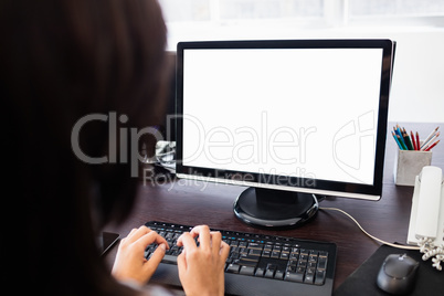 Casual businesswoman working on laptop