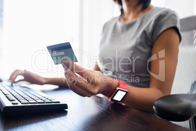 Businesswoman looking her credit card