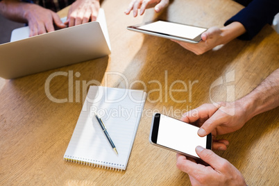 Colleagues using technology Colleagues using technology