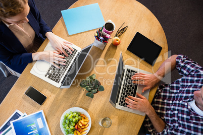 Colleagues using laptop