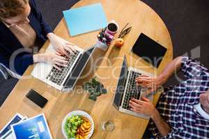 Colleagues using laptop