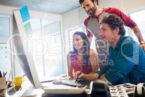 Colleagues using a graphic pad