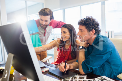 Colleagues using a graphic pad