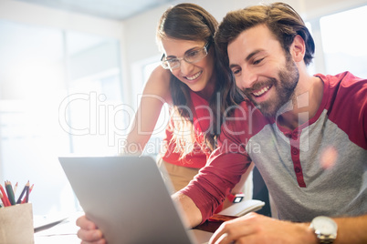 Colleagues working with a tablet