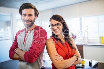 Colleagues standing with arms crossed