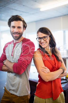 Colleagues standing with arms crossed