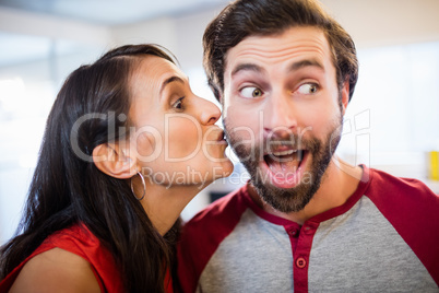Woman giving a kiss on the cheek