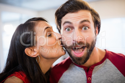 Woman giving a kiss on the cheek