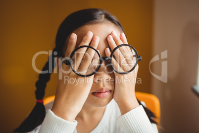 Schoolchild hiding her eyes