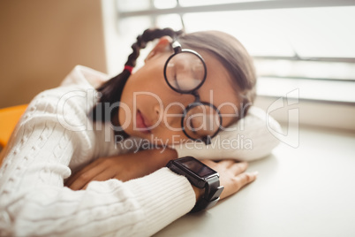 Schoolchild sleeping on desk