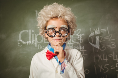 Boy standing in front of blackboard