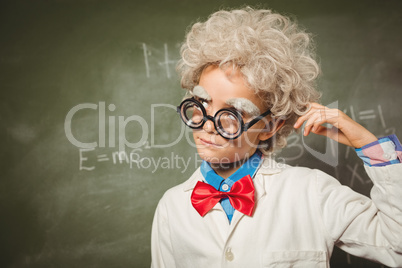 Boy standing in front of blackboard