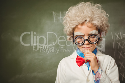 Boy standing in front of blackboard