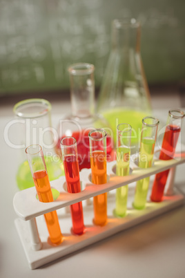 Test tube and beaker on desk