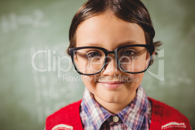 Boy standing in front of blackboard