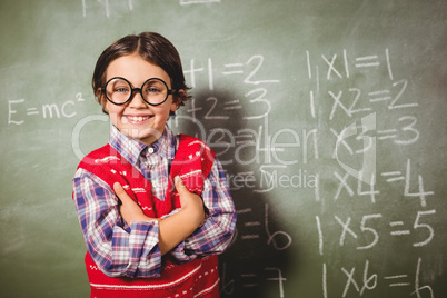 Boy standing in front of blackboard