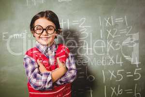 Boy standing in front of blackboard