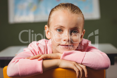 Girl leaning against chair