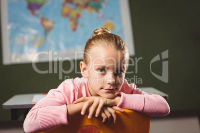 Girl leaning against chair