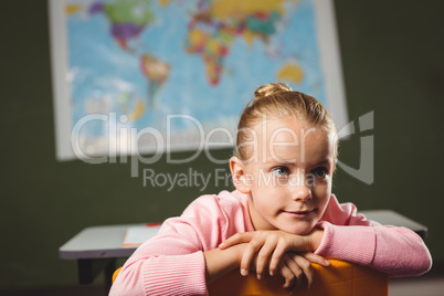 Girl leaning against chair