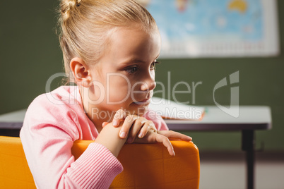 Girl leaning against chair