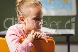 Girl leaning against chair