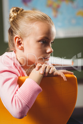 Girl leaning against chair