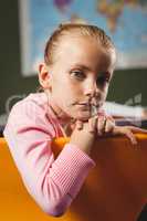 Girl leaning against chair