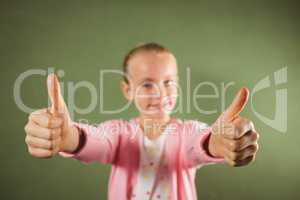 Girl standing with thumbs up