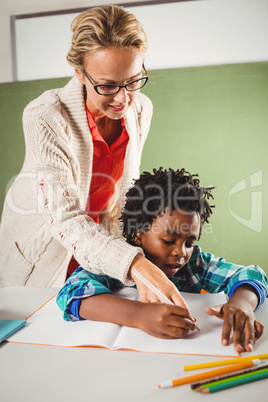 Teacher explaining exercise to boy