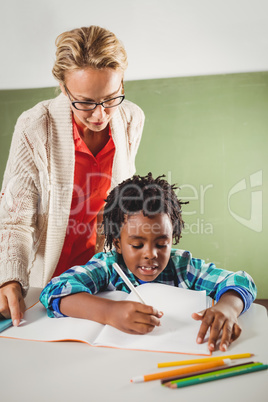 Teacher explaining exercise to boy