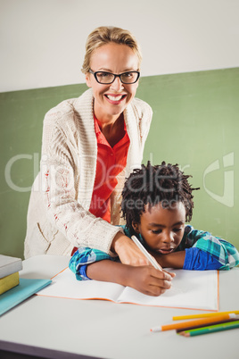 Teacher explaining exercise to boy