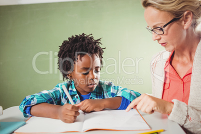 Teacher explaining exercise to boy