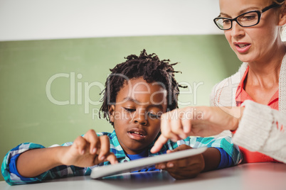 Teacher and pupil using a tablet