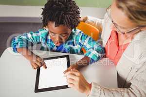 Teacher and pupil using a tablet