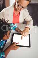 Teacher and pupil using a tablet