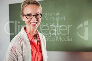 Teacher standing in front of blackboard