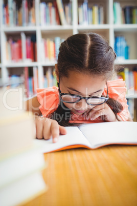 Little girl reading a book