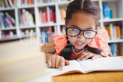 Little girl reading a book