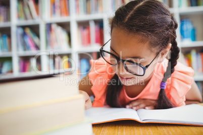 Little girl reading a book