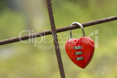 Red padlock in heart shape.