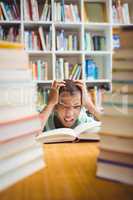 Upset boy sitting at a desk